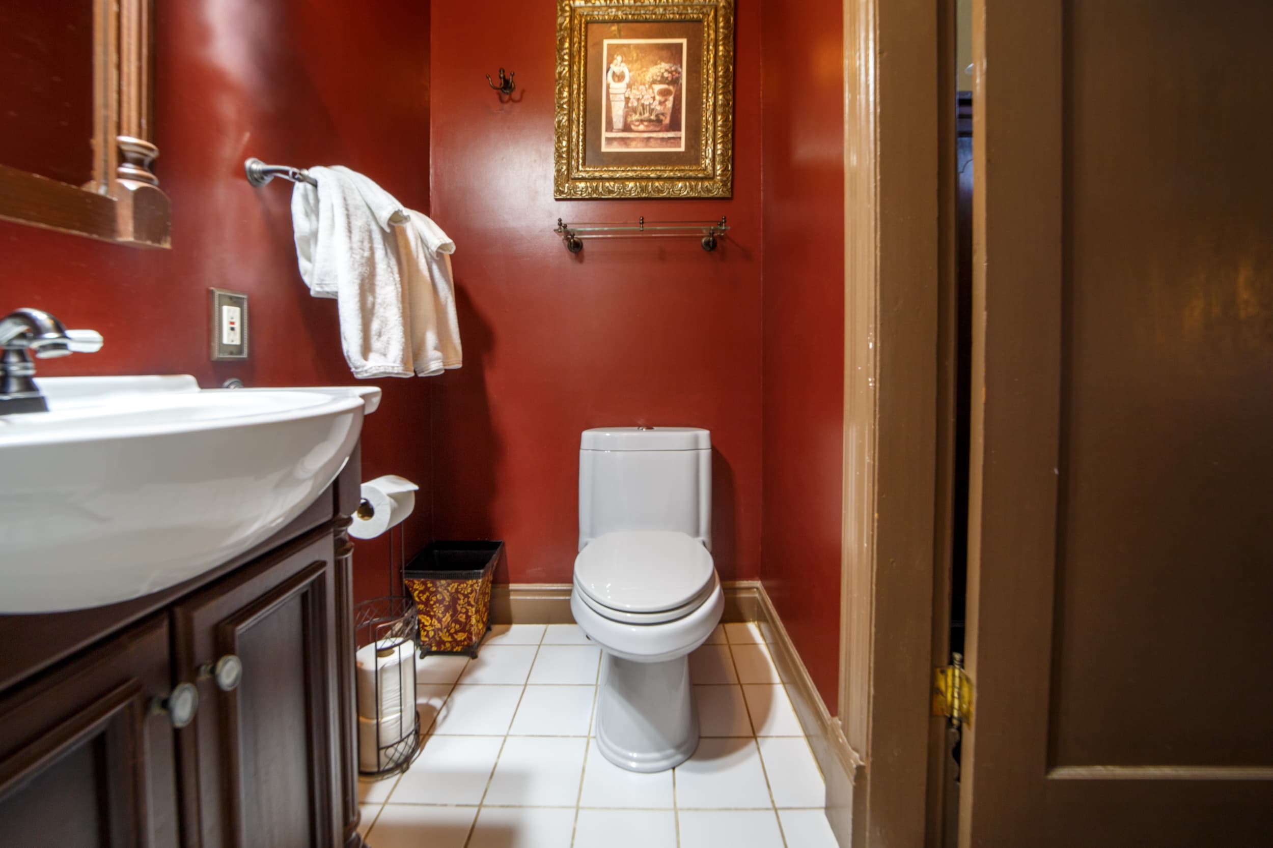 Compact bathroom with walk-in shower, vanity and toilet.