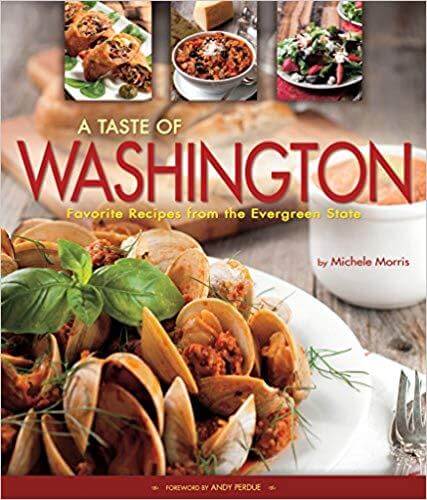A colorful cookbook cover titled "A Taste of Washington" featuring clams, pasta, and various dishes with fresh ingredients.