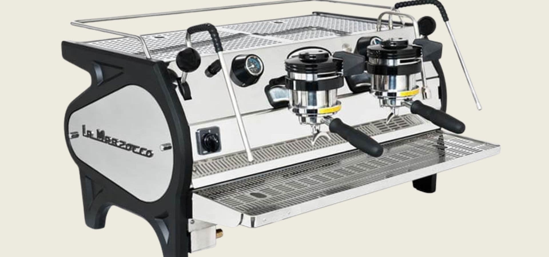 A shiny stainless steel espresso machine with two portafilters and a drip tray.