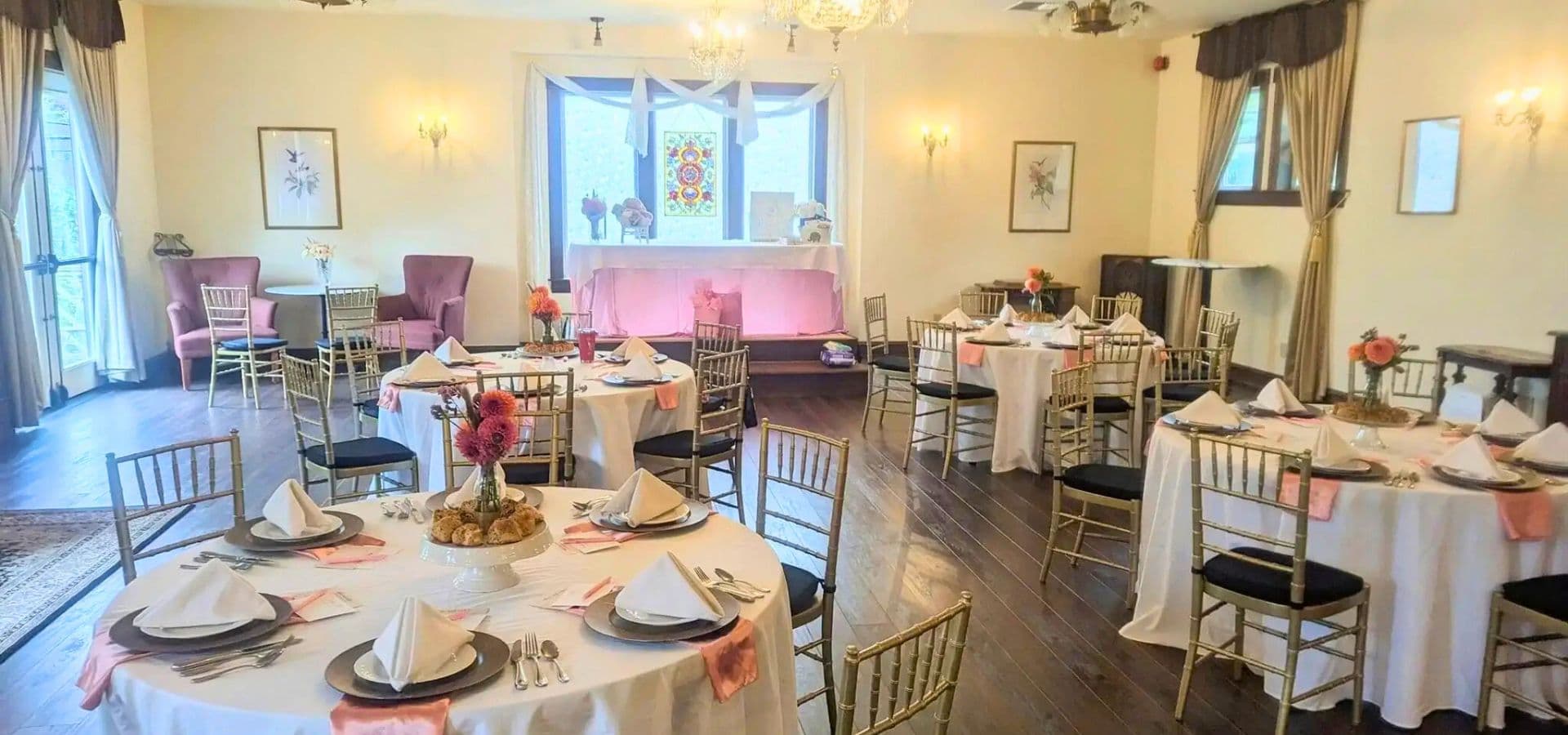 Elegant dining space with round tables set for a formal event.